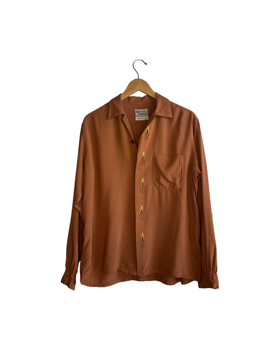 rusted color gabardine shirt from the 50s with details on button covers , single pocket and loop collar 
