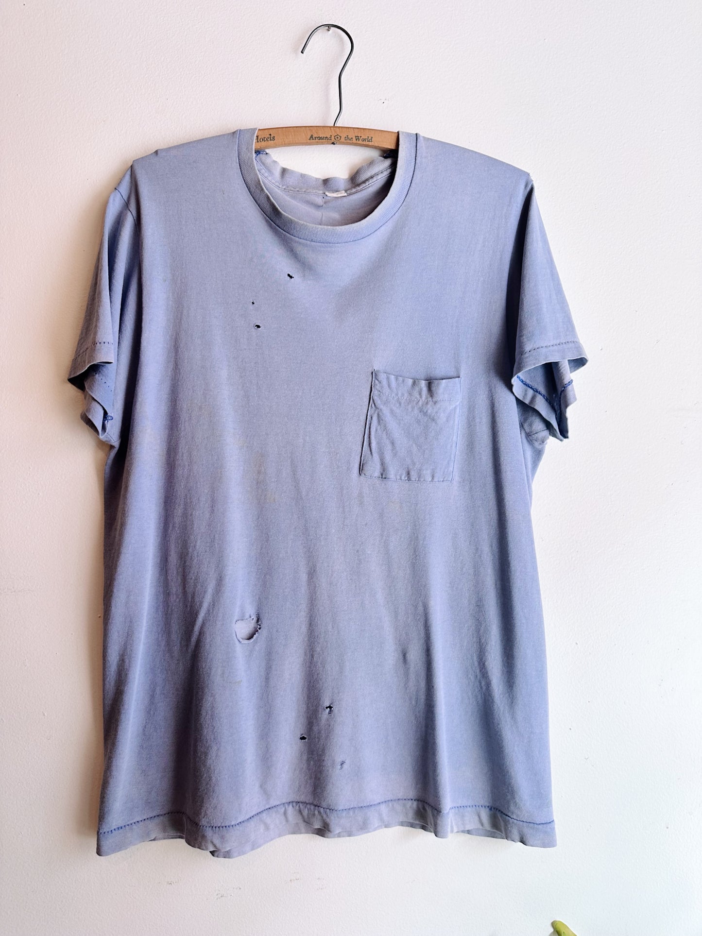 sunfaded one pocket tee with holes 