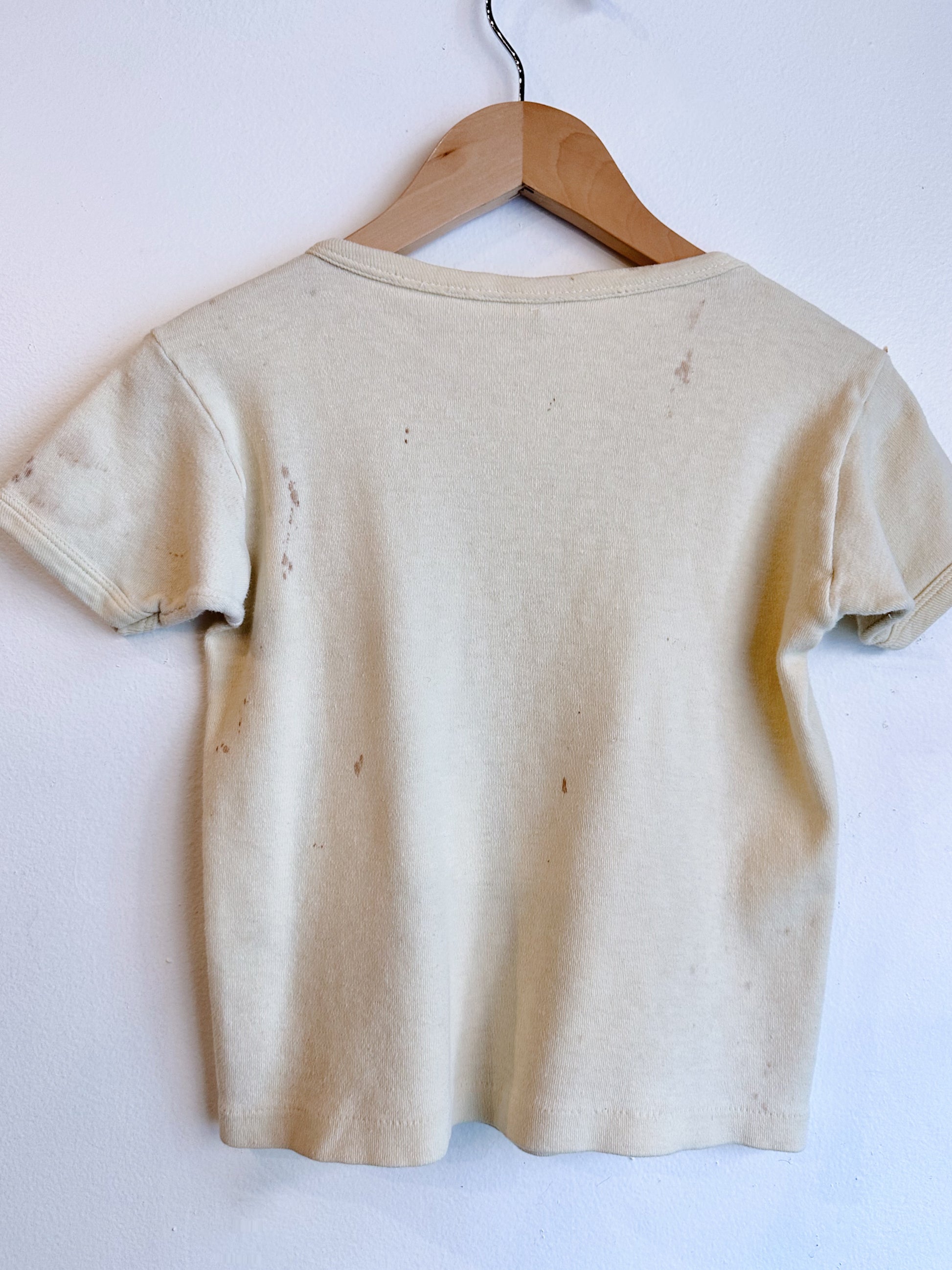 back view of t shirt with stains 